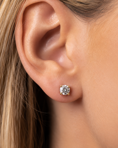 Legacy 0.50 CTW lab-grown diamond stud earrings in 14K yellow gold; approximate 4.0 mm diamond on woman model