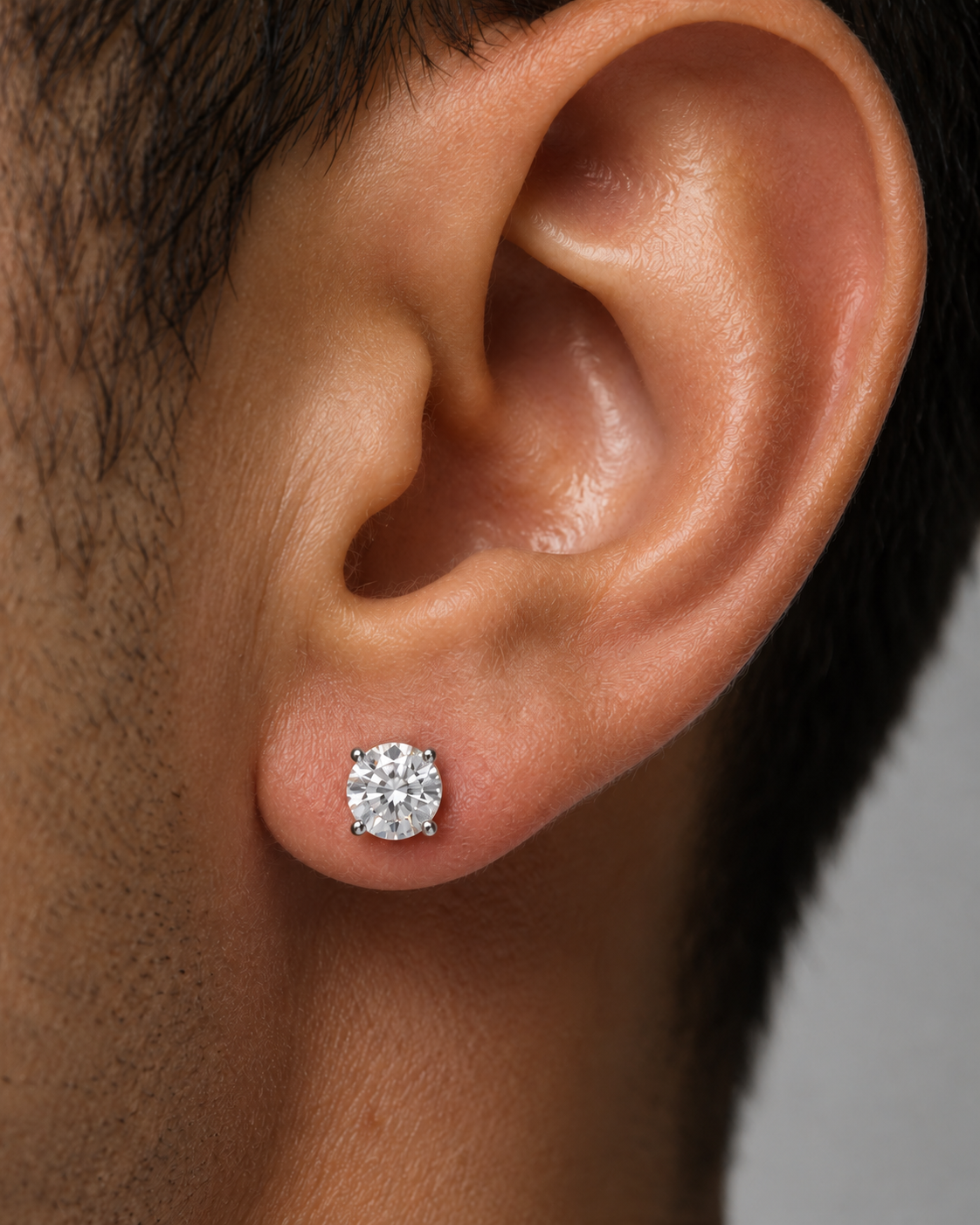 Legacy 1.00 CTW lab-grown diamond studs in 14K white gold; approximate 5.1 mm diamond on man model
