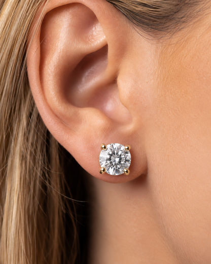 Legacy 4.00 CTW lab-grown diamond studs in 14K yellow gold; approximate 8 mm diamond on woman model