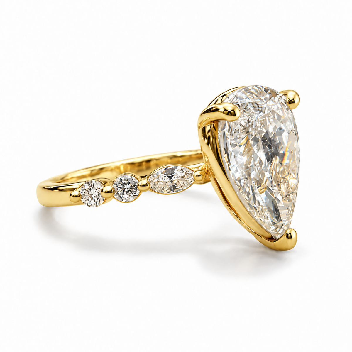 Pear-cut 2.01 carat engagement ring with all-yellow-gold setting — left three-quarter view